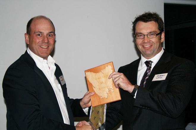 Robert Case receives his 25 Hobarts plaque from Matt Allen at the CYCA - Rolex Sydney to Hobart  © CYCA Staff .